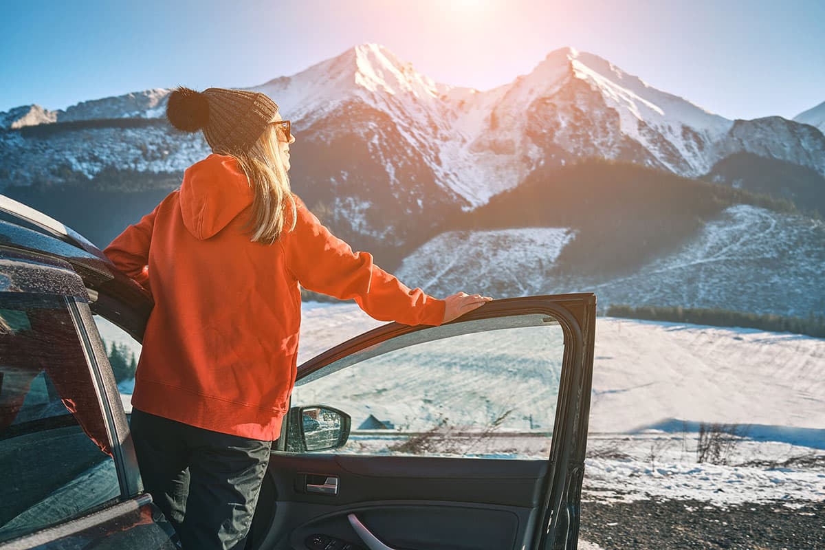 Woman traveling exploring, enjoying the view of the mountains, l