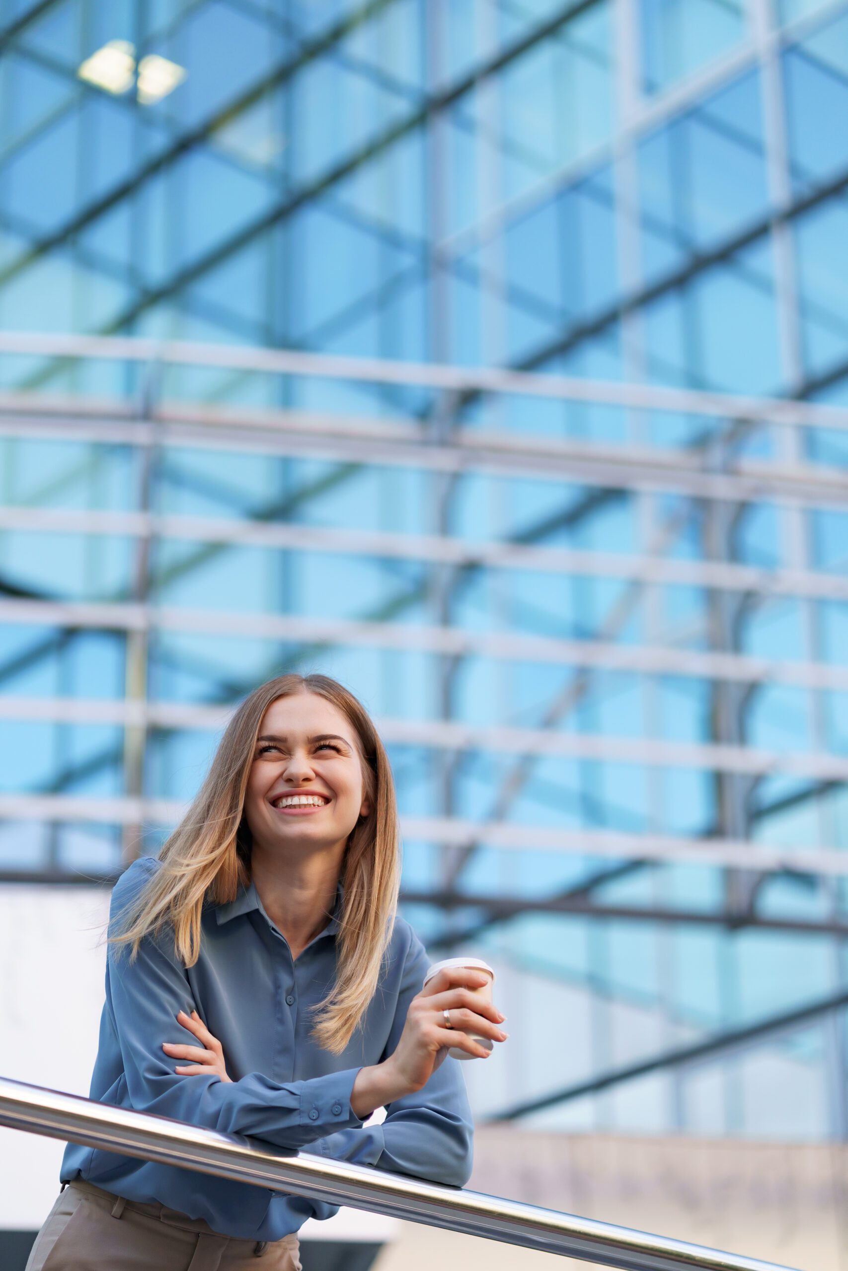Charismatic woman drinking coffee to go at work